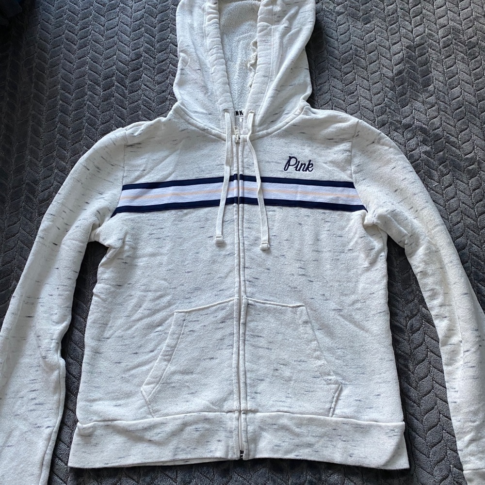 Pink zip up sweatshirt.